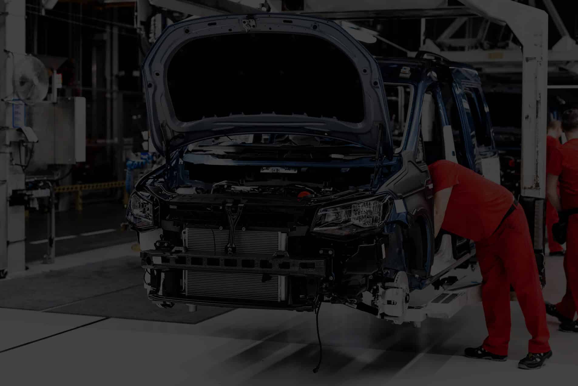 Automotive sector - Some mechanics working on a car
