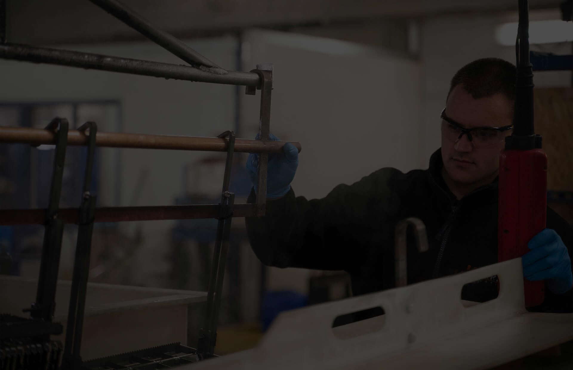 A Karas Plating employee using machinery to electroplate metal